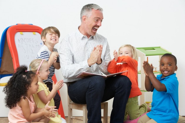 Pre School Teacher Reading Story To Children [Image © micromonkey - Fotolia.com]