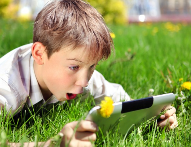 Surprised Boy with Tablet - Copyright © Sabphoto - Fotolia.com]