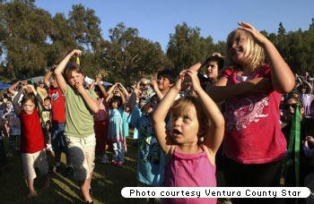 Kids emulate Charlotte Diamond at a free concert in Moorpark, California.