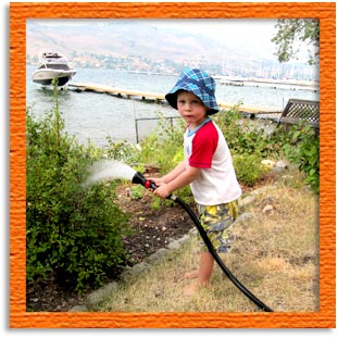 Charlotte's grandson, William, watering plants