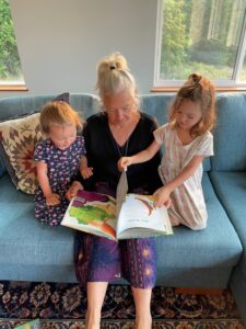 Grandmother Reading 'Charlotte Diamond's Animal Friends' to her Grandchildren